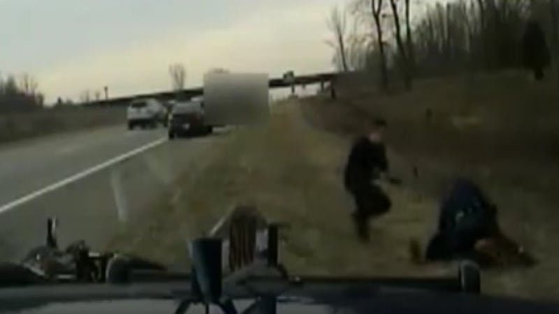 Watch as hero motorists save trooper in fight for his life
